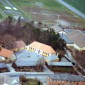 Grindsted Skole, hallen og boldbanerne. Mejeriet i forgrunden. Foto fra beg. af 1980'erne.